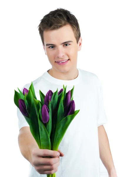 Pohledný Mladý Muž Kyticí Tulipánů — Stock fotografie