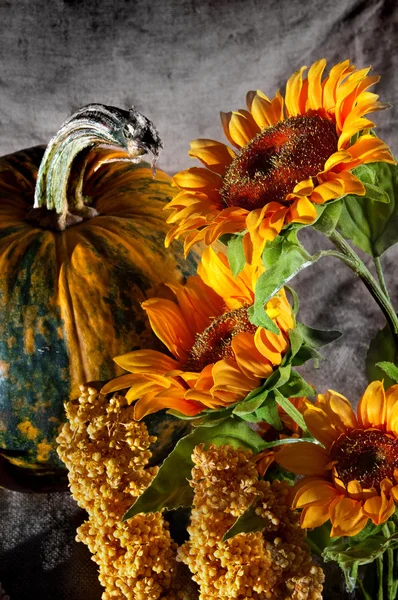 Still life with pumpkin and sunflowers — Stock Photo, Image