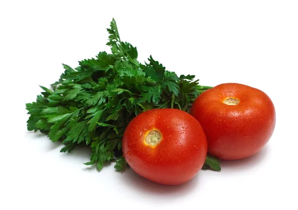 Bosje verse peterselie en twee tomaten — Stockfoto