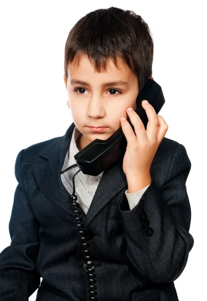 Young boy talking on the phone Stock Picture