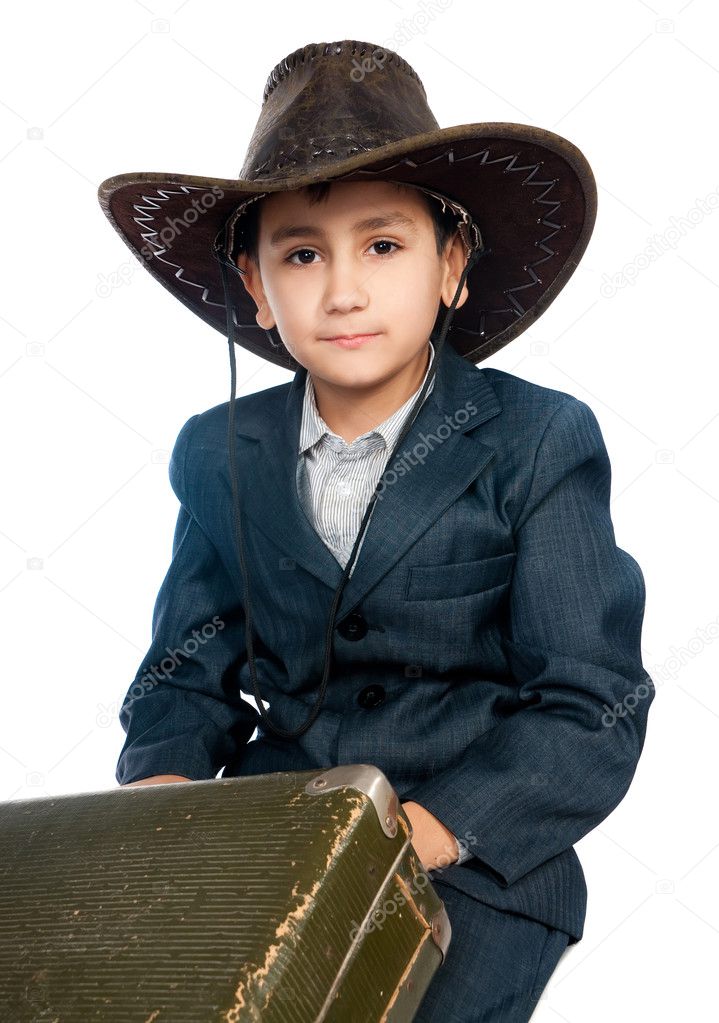 Boy In A Cowboy Hat And Carrying A Suitcase Stock Photo GekaSkr 