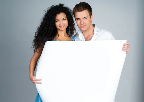 Couple holding a paper — Stock Photo, Image
