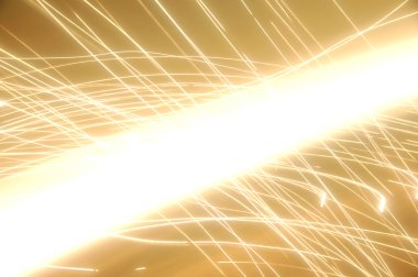 Shiney golden background that looks like sparks, fireworks, and electricity. Good for text. clipart