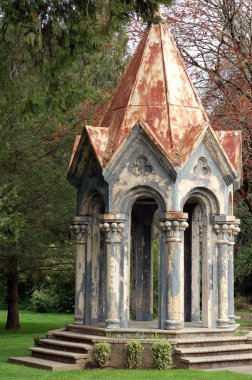 A top of a church cut off and made as a little building that looks like a gazebo. clipart