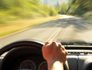 Driving inside a car on a country street, Speeding zooming fast down the road. clipart