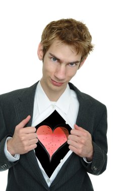 A young boyfriend in a business suit pulls open his clothing to reveal his heart with a smirk on his face. clipart