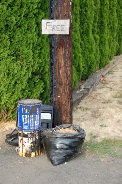 A pile of free stuff outside of someones home. clipart