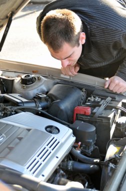 Man Repairing Broken Down Car clipart