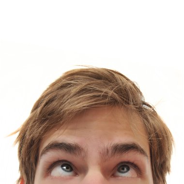 Young adult man staring up with cross eyes into empty white isolated copy space clipart