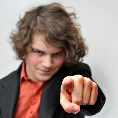 Young businessman points his finger at you clipart