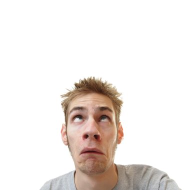 Young man looking upward overhead with a scared frown on his face isolated on white square background with room for your text clipart