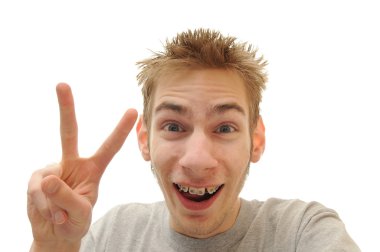 Young adult white man shows a peace sign. He has braces. Image is isolated on white background clipart