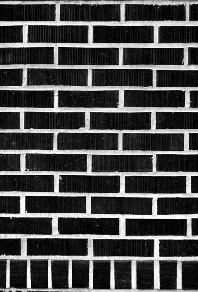 Schwarze Ziegelmauer — Stockfoto