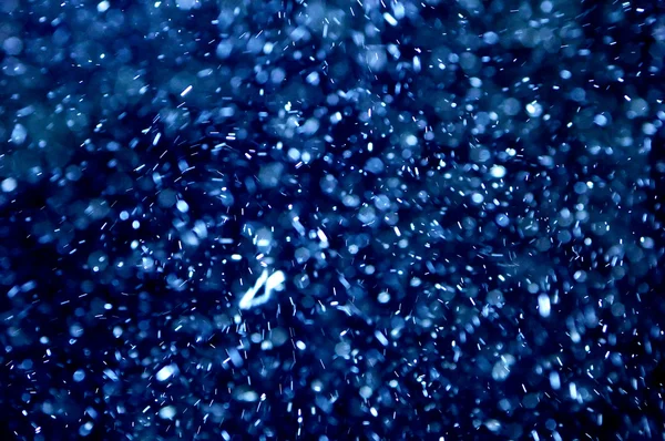 Абстрактное Изображение Летящих Вокруг Света Мыльных Пузырей Похожих Снег — стоковое фото