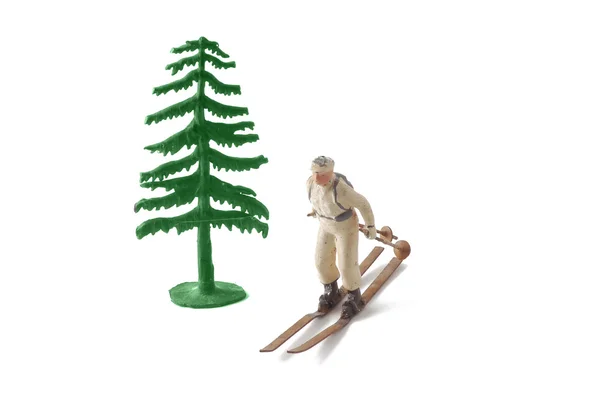 Miniaturbaum Und Skifahrer Isoliert Auf Weiß — Stockfoto