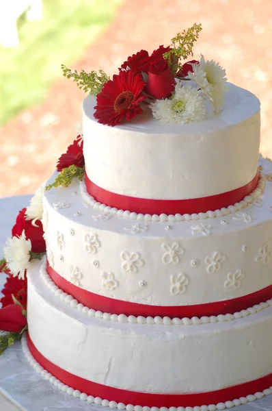 stock image Wedding cake with red stripes and flowers