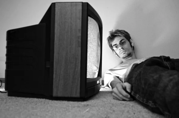 Watching TV on the floor — Stock Photo, Image