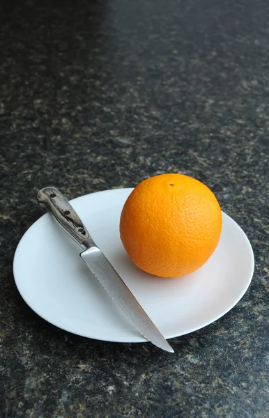 Orange on a plate — Stock Photo, Image