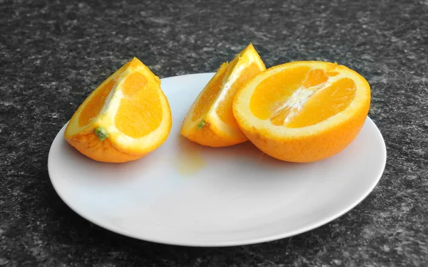 Orange on a plate — Stock Photo, Image