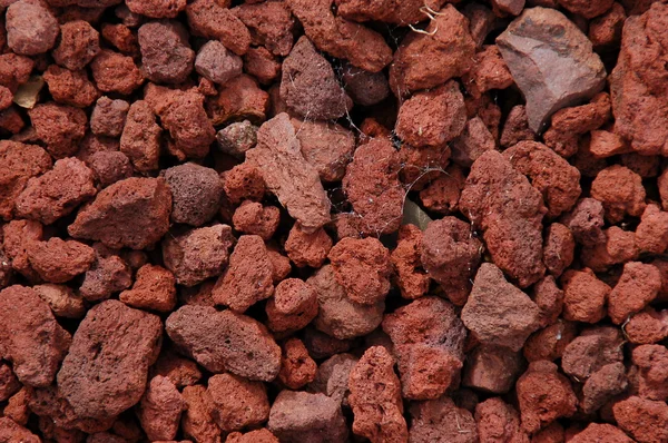 Banda Malých Červené Sopečné Lávové Kameny — Stock fotografie