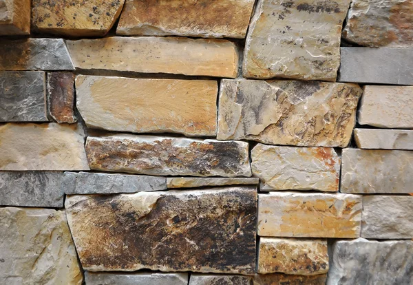 Close Van Een Stenen Muur Textuur Geel Bruin — Stockfoto