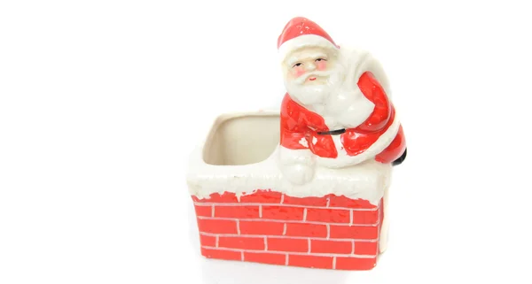 Santa claus rusten op een schoorsteen — Stockfoto