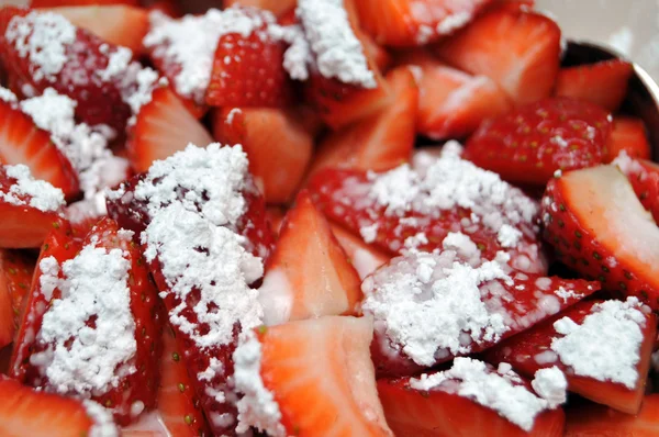 stock image Close up of strawberries with powdered sugar. Macro photograph has shallow Depth of Field.