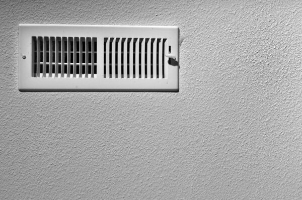 Black and white photograph of a ceiling vent background.