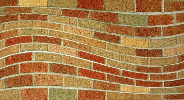 Muro ondulato di mattoni — Foto Stock