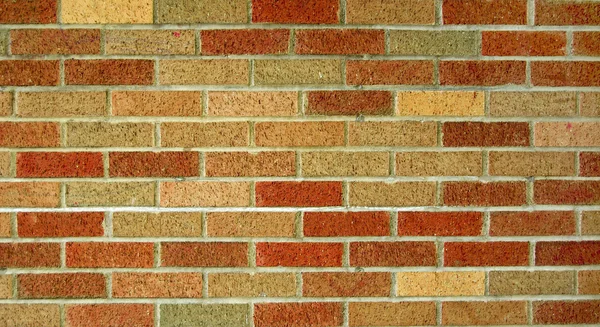 Muro di mattoni rossi e marroni — Foto Stock