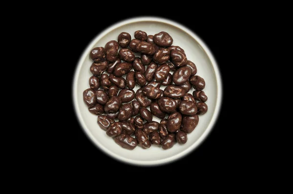Chocolate raisins in bowl — Stock Photo, Image