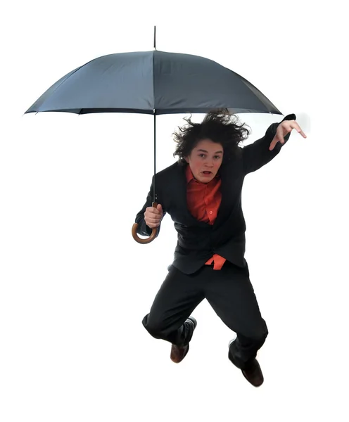 Businessman jumping with Umbrella — Stock Photo, Image