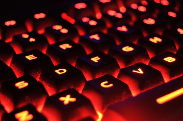Abstract Closeup Red Illuminated Backlit Glowing Computer Keyboard — Stock Fotó