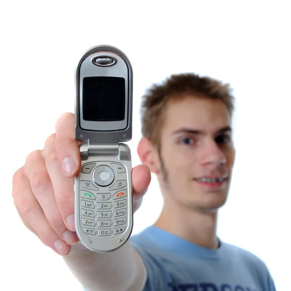 Young adult talks on cell phone — Stock Photo, Image