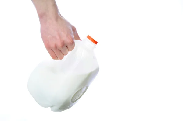 Arm Hand Houden Kunststof Melkpakken Kruik Geïsoleerd Een Witte Achtergrond — Stockfoto