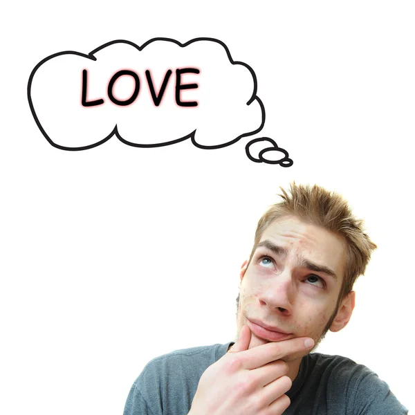 Jonge man denkt dat liefde — Stockfoto