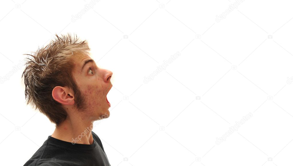 Young man spewing out blank empty copy space. Isolated on white.