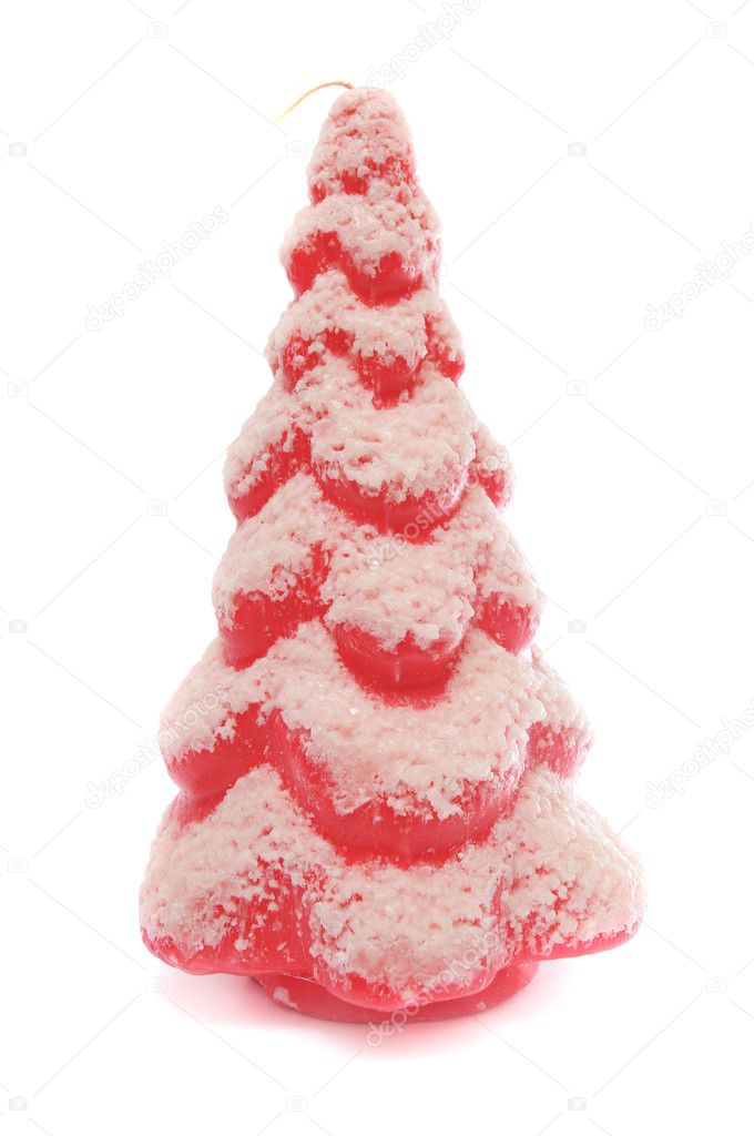 A red and pink Christmas tree with flocked snow frost on it. This is a wax candle isolated on a white background