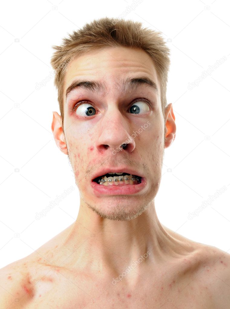 A silly white male isolated on white background with his throat tenses up with his eyes crossed.