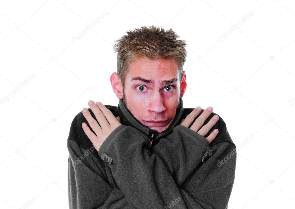 Man shivering with a red face isolated on white background. Young white adult.