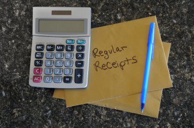 A blank calculator with a gold envelope that says Regular Receipts clipart