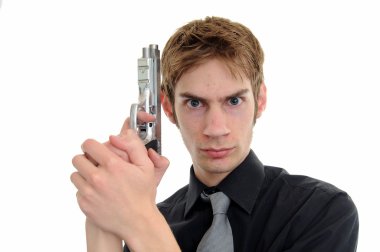 Undercover cop aims with his handgun pistol on white background.