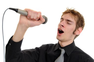 Young man sings into a karaoke microphone isolated on white clipart