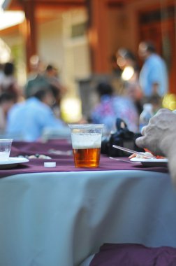 Beer cup on table at a party clipart