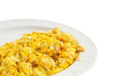 Two Scramled eggs isolated on white background on a white plate.