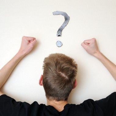 Young white Caucasian male adult staring forward, confused, with a question mark above his head on the wall. Focus point is on the person's head. clipart