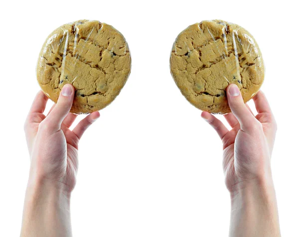 Two Hands Holding Two Cookies Shrink Wrap Isolated White Background — Stock Photo, Image