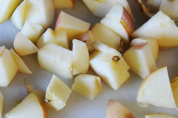Sliced up apples on cutting board