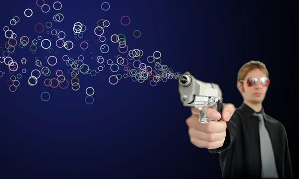 Young Man Holds His Pistol Out Shoots Out Bubbles — Stock Photo, Image