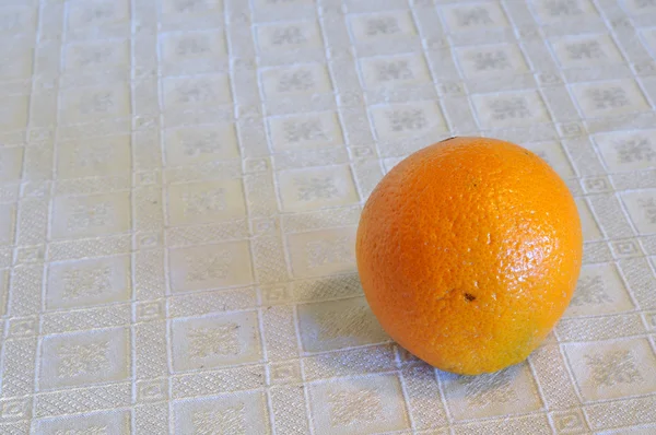Orange on a table — Stock Photo, Image